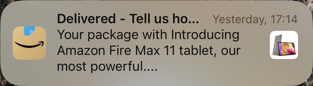 An iOS notification showing the purchase of the Amazon Fire Max 11